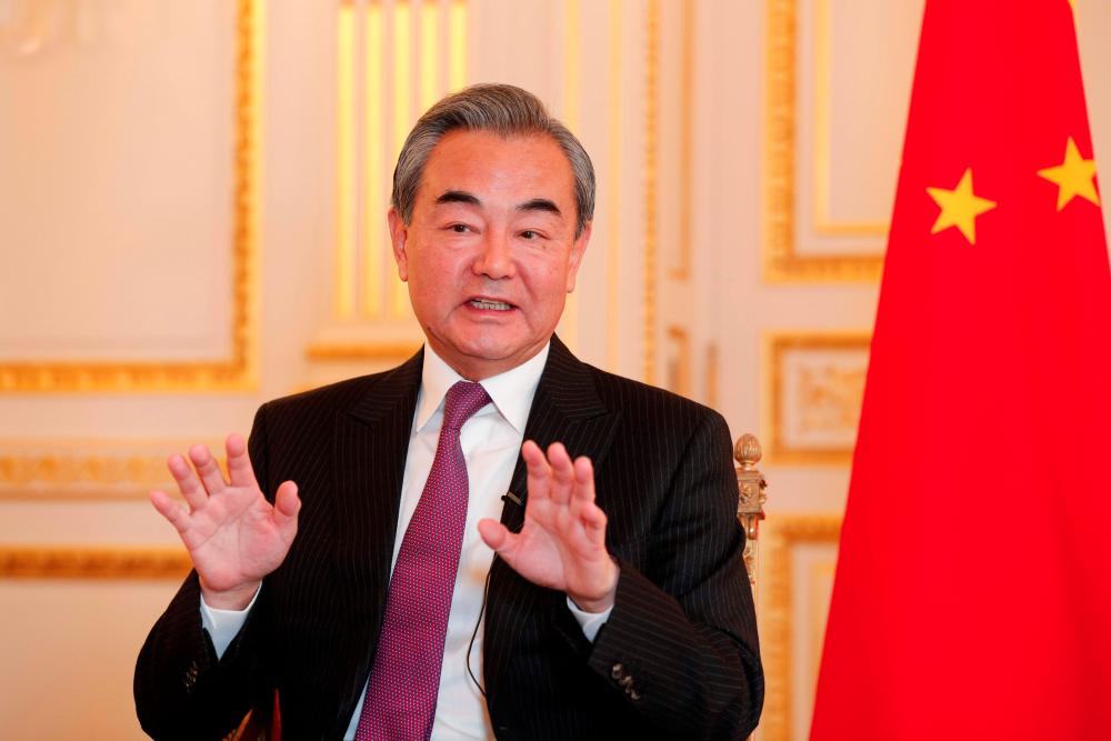 Chinese Foreign Minister Wang Yi gestures during an interview with AFP in Paris on Oct 21, 2019. — AFP