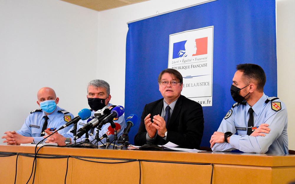 French public prosecutor of Nancy François Perain (2nd R), flanked by Colonel François Depres (L), Coordinator of the Lorraine Judicial Police, Colonel Christophe Le Gallo (2nd L), Nancy Research Section Commander, and Colonel Brice Mangou (R), Commander of the Vosges gendarmerie group, speaks during a press conference on the case of missing child Mia and her mother, in Nancy, eastern France on April 18, 2021. –AFP