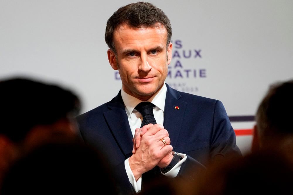 French President Emmanuel Macron reacts during the National Roundtable on Diplomacy at the Foreign Ministry in Paris on March 16, 2023. AFPPIX