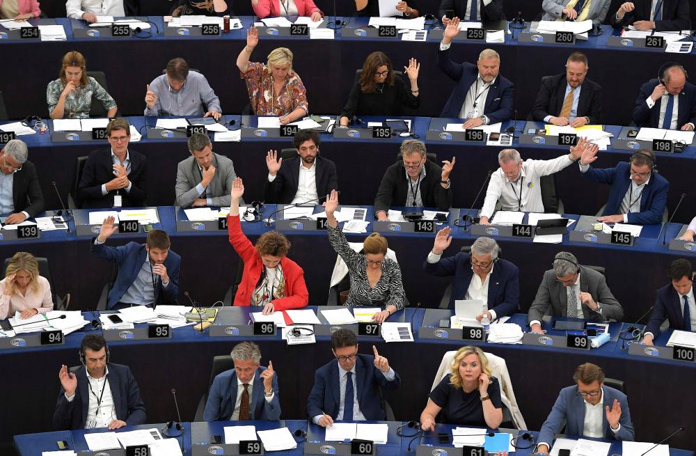 Members of the European Parliament take part in a voting session during a plenary session at the European Parliament in Strasbourg, eastern France, yesterday. – AFPpix