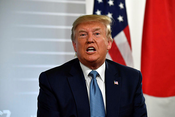 US President Donald Trump speaks during a bilateral meeting with Japan’s Prime Minister at the Bellevue centre in Biarritz, south-west France on August 25, 2019. — AFP