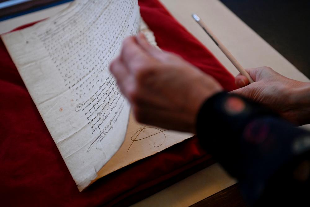 This photograph taken on November 23, 2022, shows the encrypted letter from Charles V, also known as Charles Quint, the Holy Roman Emperor and Archduke of Austria, dated from 1547, at the Stanislas library in Nancy, northeastern France, on November 23, 2022. AFPPIX