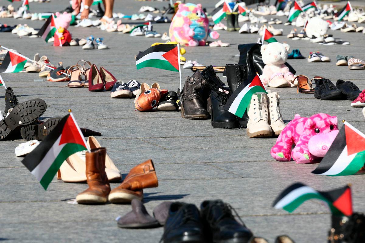 This photograph shows shoes laid out on Place Kleber symbolising Palestinians killed during over Israel’s offensive on the Gaza strip, in Strasbourg, eastern France, on September 20, 2025, as part of a symbolic action named “Operation Shoes – Lives, not just numbers!” by the Collectif Palestine 67. (Photo by Frederick FLORIN / AFP)