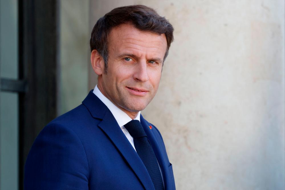 French President Emmanuel Macron waits to welcome the Moldovan president after their meeting at the Elysee Palace in Paris on May 19, 2022. AFPPIX