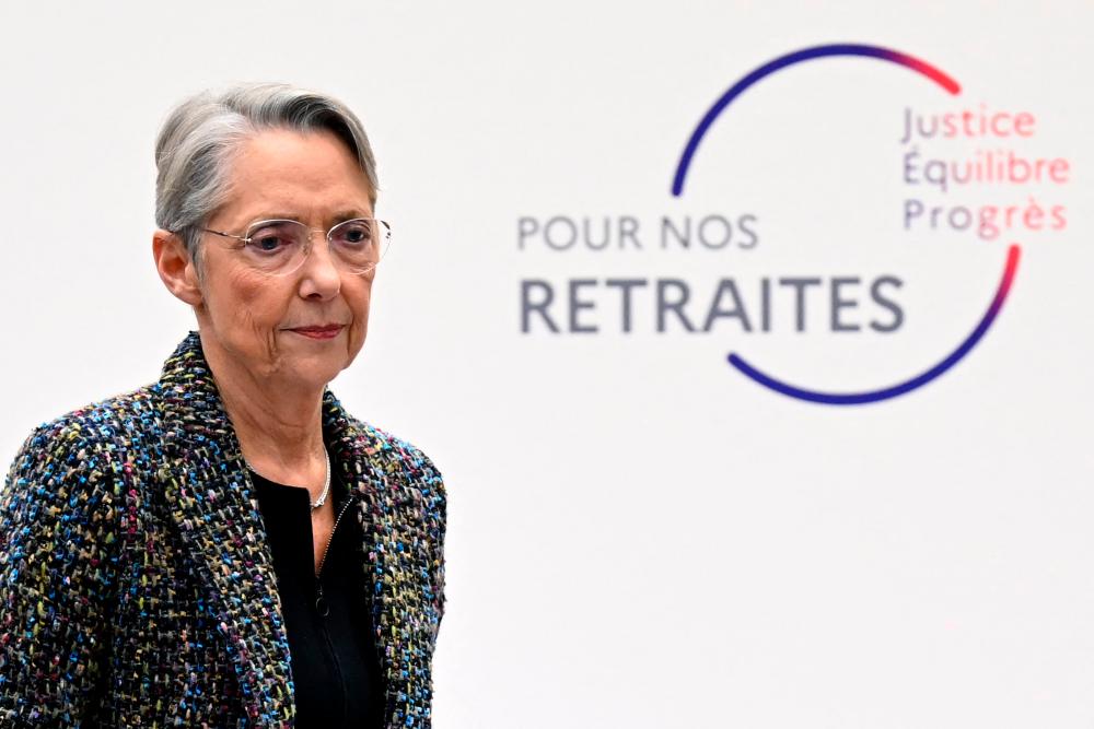 France’s Prime Minister Elisabeth Borne walks off the stage after presenting the government’s plan for a pension reform during a press conference in Paris on January 10, 2023/AFPPix