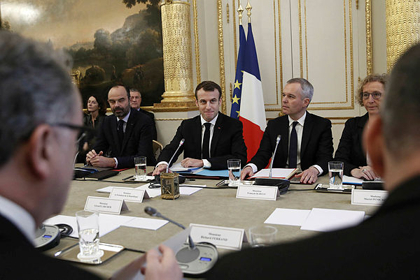 French President Emmanuel Macron, and other high-ranking government officials meet with representatives of trade unions, employers’ organisations and local elected officials at the Elysee palace in Paris, part of consultations to end the so called ‘Yellow vests’ crisis, on Dec 10, 2018. — AFP