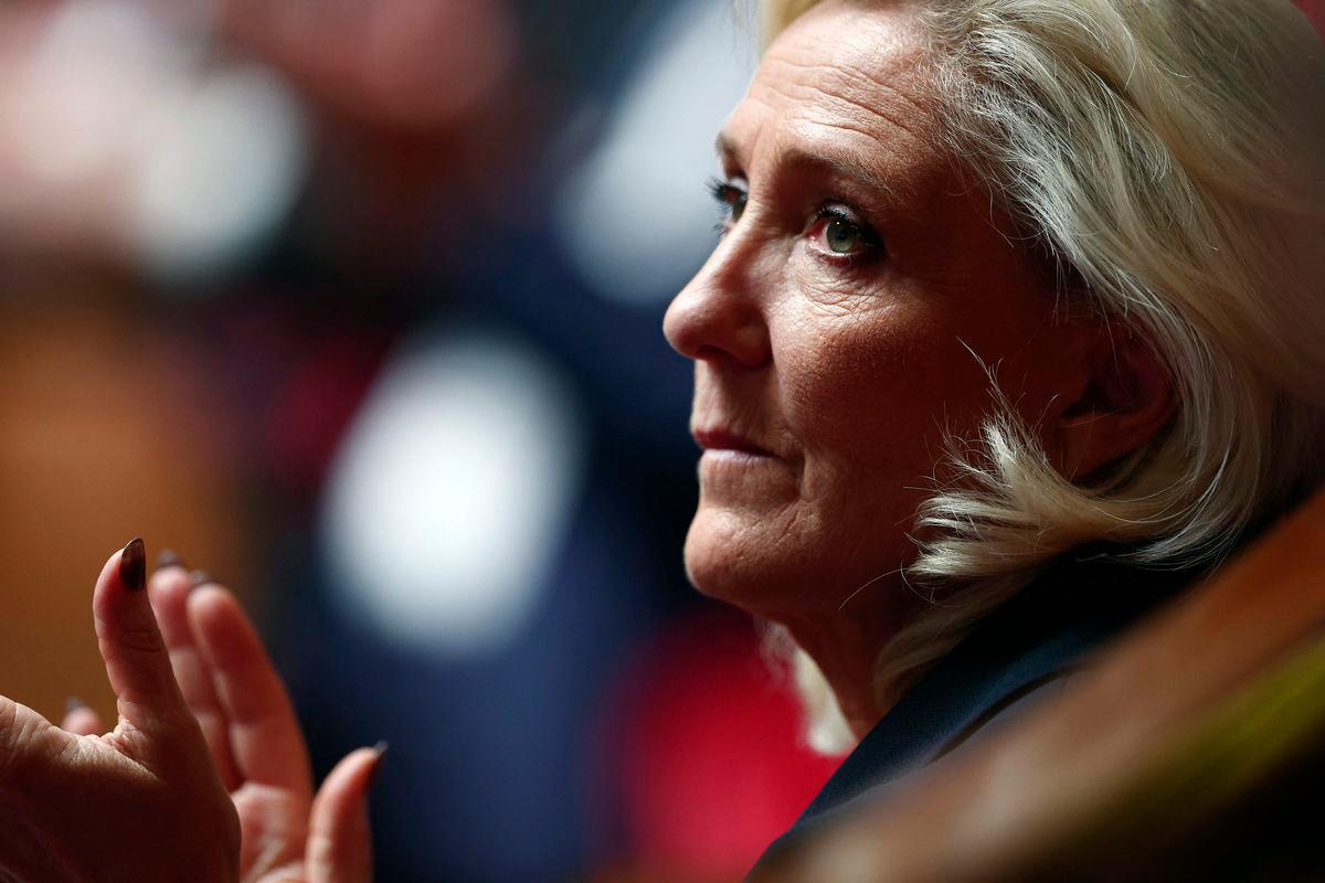 President of Rassemblement National parliamentary group Marine Le Pen applauds during a debate at the National Assembly before a vote on the ‘Duplomb law’ on agriculture which aims to reintroduce a pesticide for certain crops, in Paris on July 8, 2025. (Photo by Guillaume BAPTISTE / AFP)