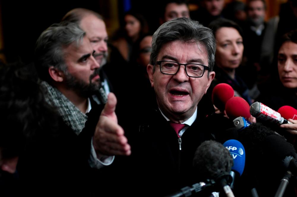 France's leftist party La France Insoumise (LFI) president Jean-Luc Melenchon answers journalists' questions at the courthouse in Bobigny, north of the French capital Paris, following the sentence hearing of his trial after he shoved prosecutor in office during the search of October 2018 at the headquarters of LFI. — AFP