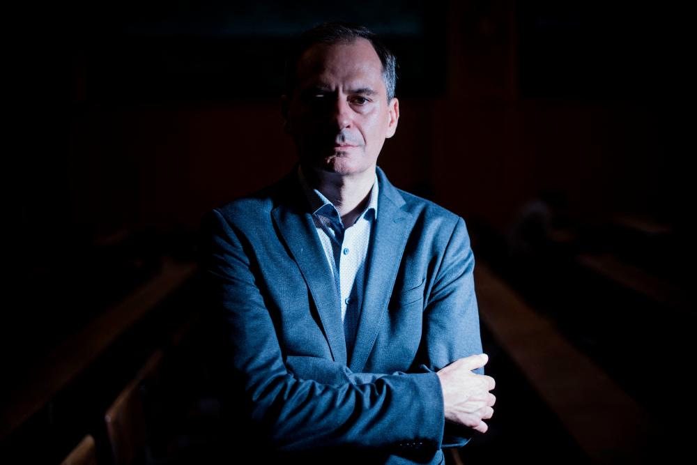 Bulgarian investigative journalist and lead Russia investigator with Bellingcat Christo Grozev poses for a photo session at the Institute of Political Studies (Sciences Po) in Paris, on September 5, 2022. AFPPIX