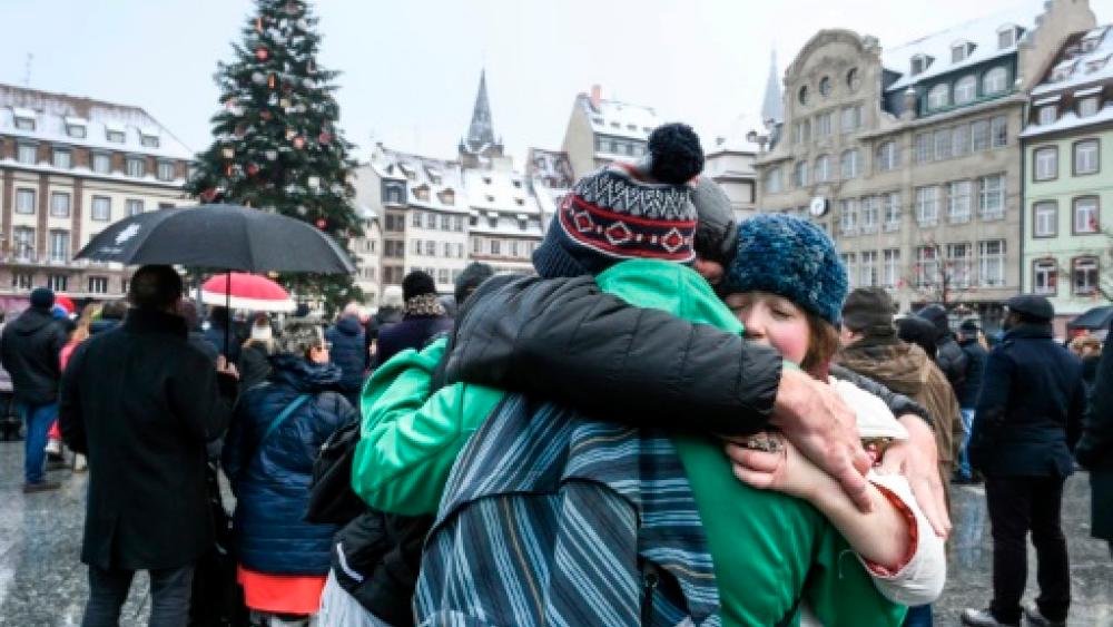 Hundreds of people gathered at the Christmas market in Strasbourg, eastern France, on Sunday to honour the victims of a gunman’s shooting spree last week. — AFP