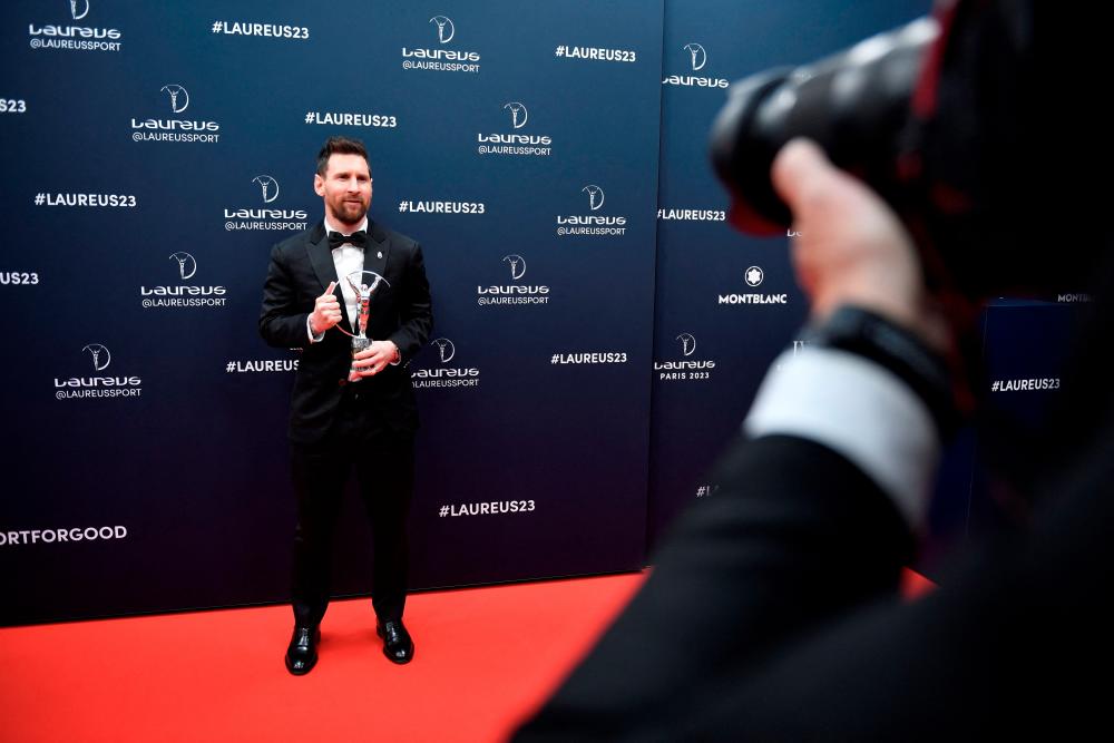 Argentinian football player Lionel Messi poses with his Laureus World Sportsman of the Year award during the 2023 Laureus World Sports Awards ceremony in Paris on May 8, 2023. AFPPIX