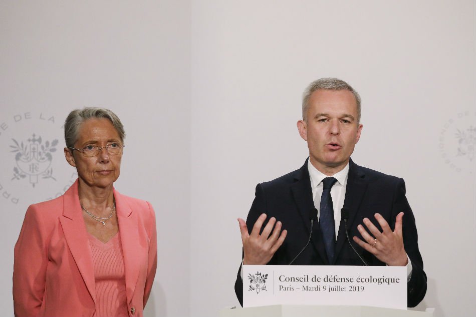 Then French Environment Minister Francois de Rugy (R) and French Transports Minister Elisabeth Borne give a press conference during an Ecological Defense Council, in Paris. — AFP