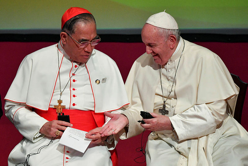 Pope Francis speaks with Cardinal Francis Xavier Kriengsak Kovithavanij during a meeting with religious leaders at the Chulalongkorn University in Bangkok, Thailand, Nov 22, 2019. — Reuters