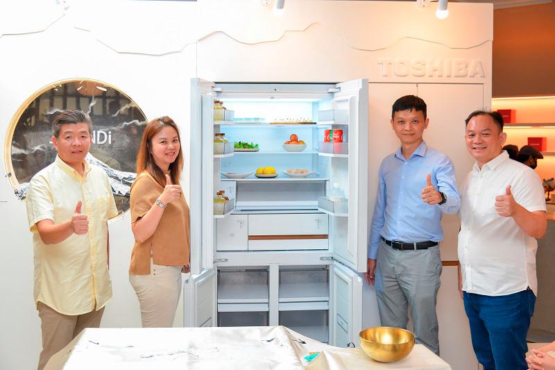 $!Yang (second from right) with Toshiba’s Japandi fridge.