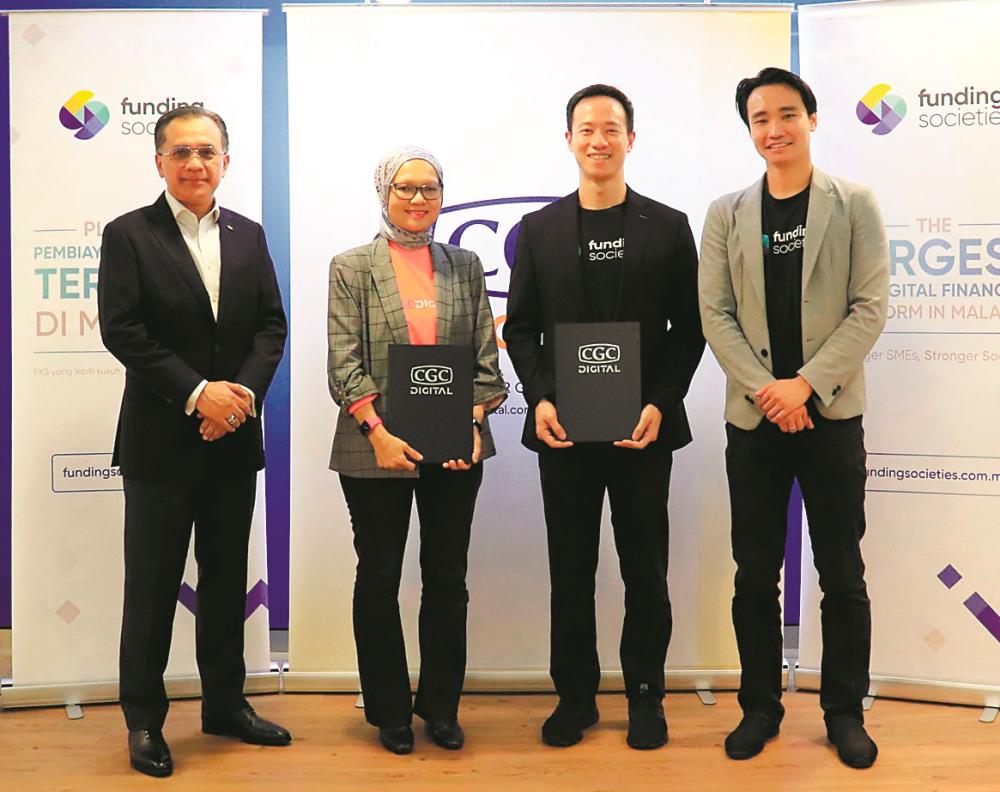 From left: CGC president/CEO Datuk Mohd Zamree Mohd Ishak, Yushida, Wong and Funding Societies/Modalku co-founder and group CEO Kelvin Teo.