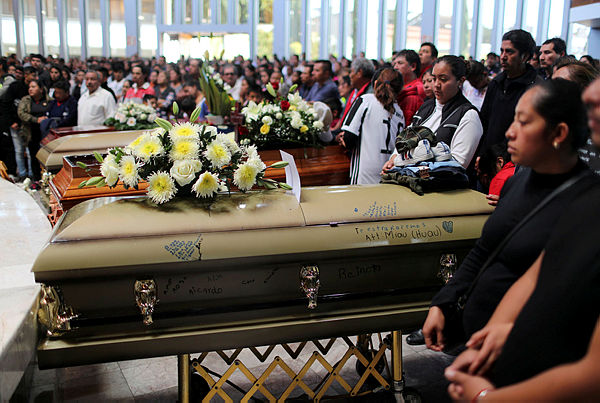 Relatives of people who died in an explosion of a fuel pipeline ruptured by oil thieves attend their funeral mass at a church in the municipality of Tlahuelilpan, state of Hidalgo, Mexico . — Reuters