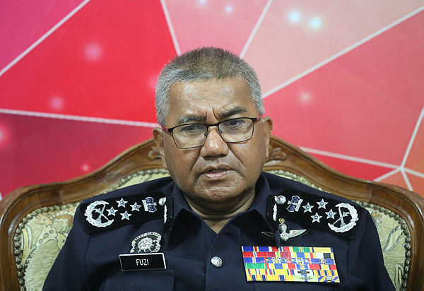 Inspector-General of Police Tan Sri Mohamad Fuzi Harun attends the presentation of the Police Excellent Service Award 2018 at the Bukit Aman Police Senior Officers’ Mess on March 6, 2019. — Sunpix by Asyraf Rasid