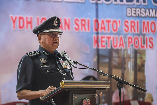 Inspector-General of Police Tan Sri Mohamad Fuzi Harun speaks during a Crime Prevention Patrol Programme at Berjaya Times Square, Kuala Lumpur on Jan 24, 2019. — Sunpix by Adib Rawi Yahya