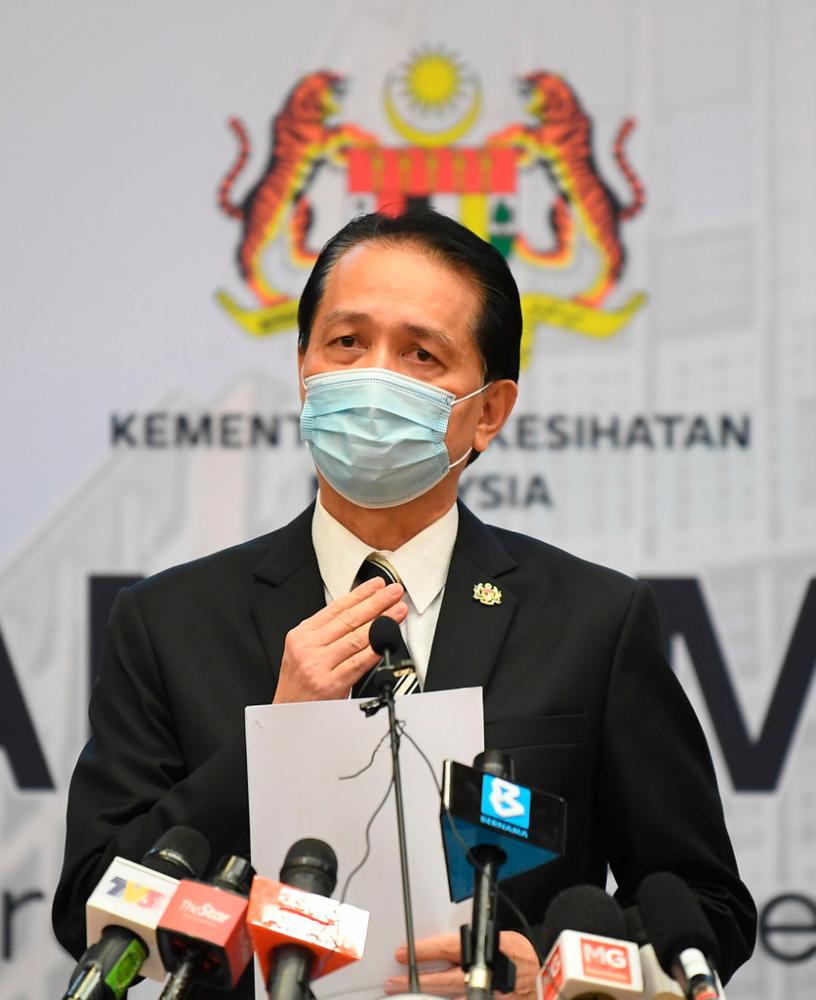 Health director-general Tan Sri Dr Noor Hisham Abdullah addresses the statistics on the outbreak during a press conference on Covid-19 updates at the Ministry of Health today. -Bernama