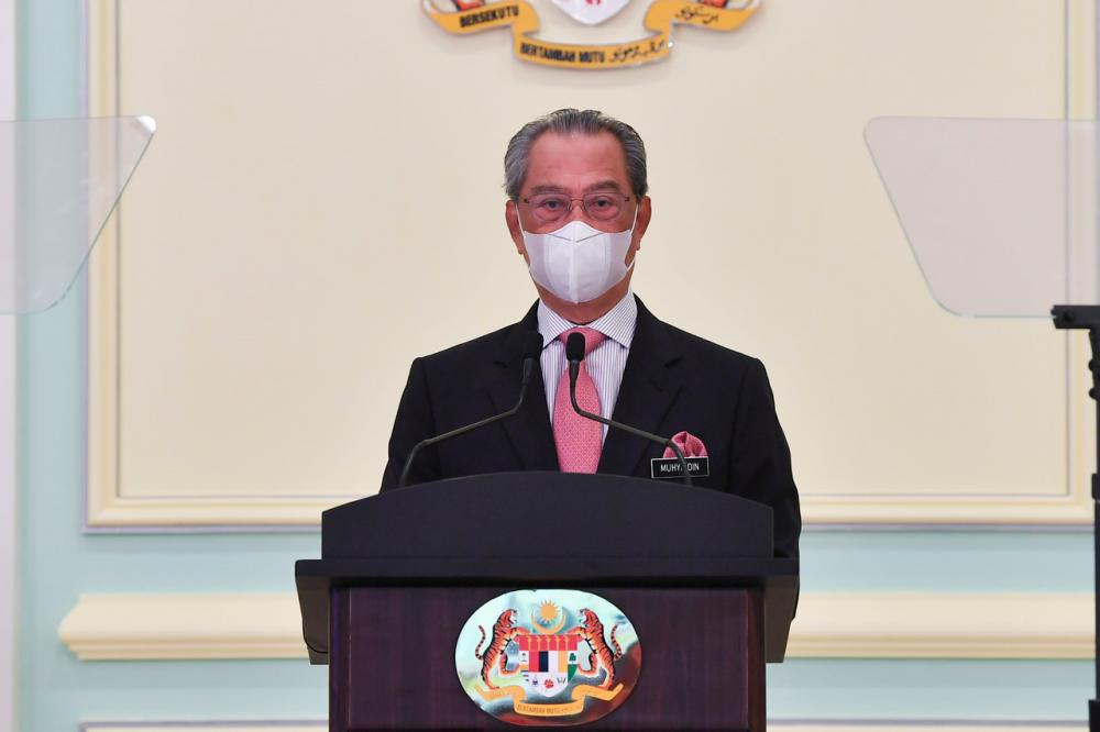 Prime Minister Tan Sri Muhyiddin Yassin delivering a speech at the launch of the National COVID-19 Immunisation Programme Handbook on Feb 16. --fotoBERNAMA (2021) Copyrights Reserved