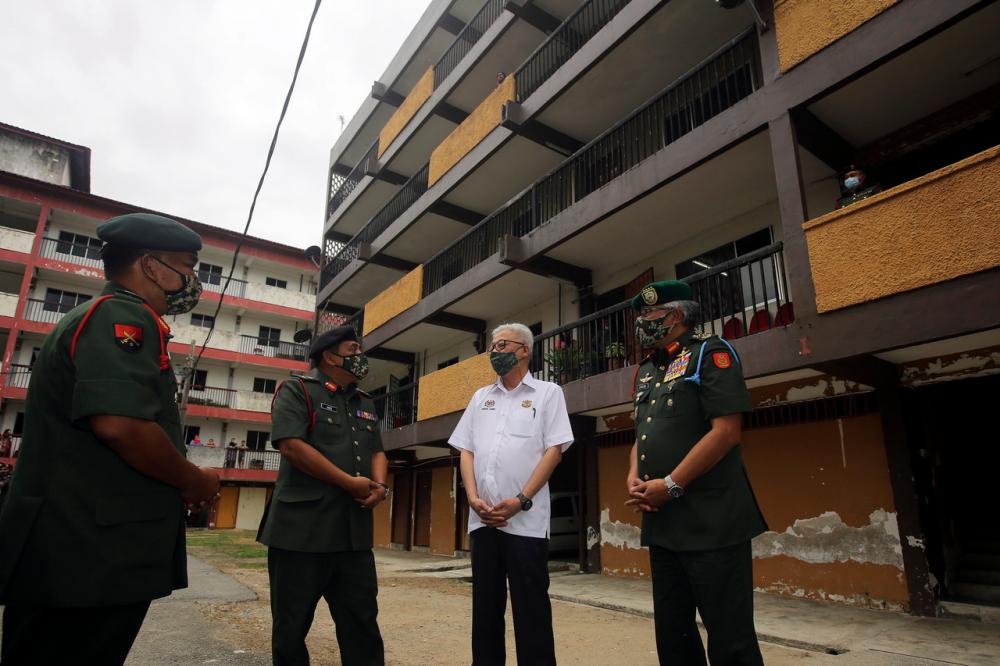 Senior Minister (Security Cluster) Datuk Seri Ismail Sabri Yaakob (second right) during a visit to Rumah Keluarga Angkatan Tentera (RKAT) Markas 1 Briged Kem Sikamat on Feb 20. - Bernama