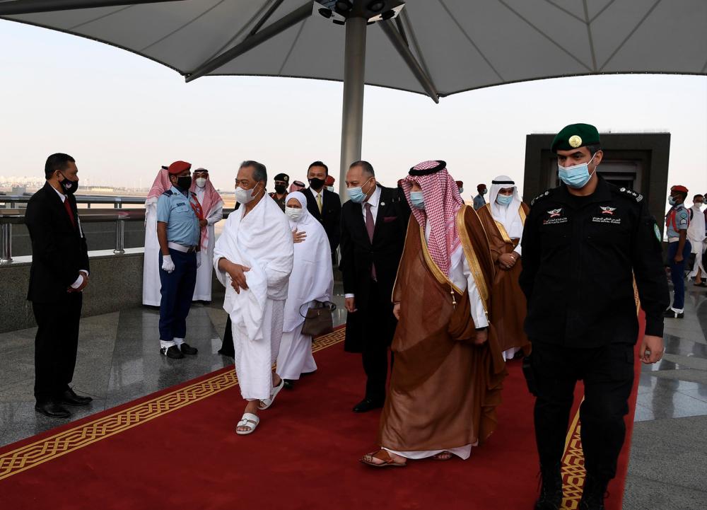 Prime Minister Tan Sri Muhyiddin Yassin and his wife Puan Sri Noorainee Abdul Rahman during arrival at King Abdulaziz International Airport.- Bernama