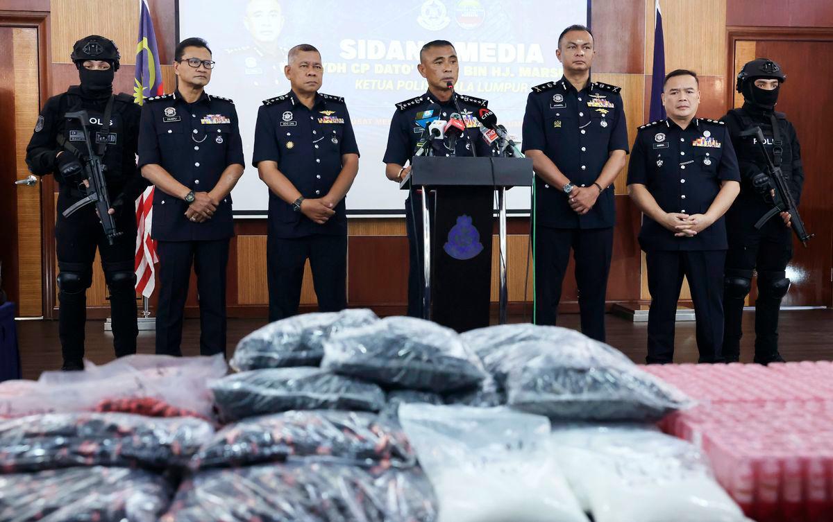 Kuala Lumpur Police Chief Datuk Fadil Marsus (centre) speaks during a press conference today. - BERNAMA