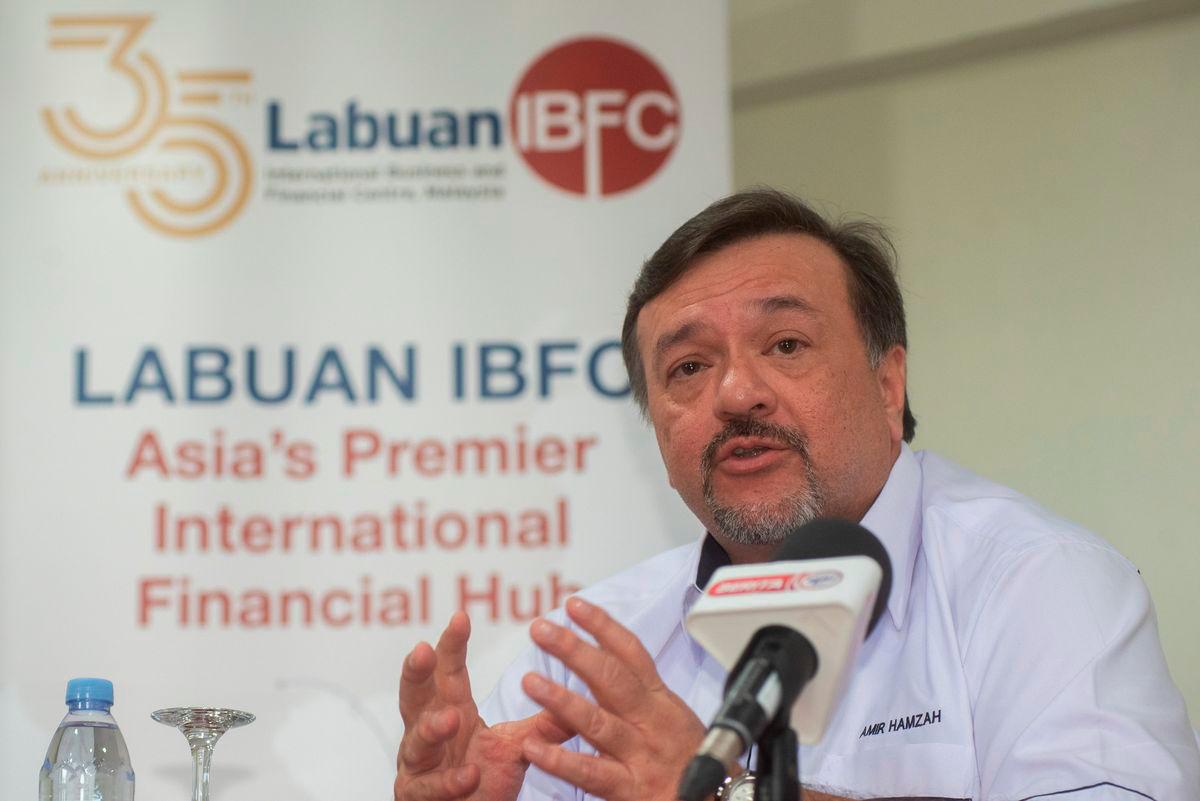 Finance Minister II, Datuk Seri Amir Hamzah Azizan, speaks at a press conference after officiating the 35th Anniversary of the Labuan International Business and Financial Centre (IBFC) Malaysia at Labuan International School today. - BERNAMA