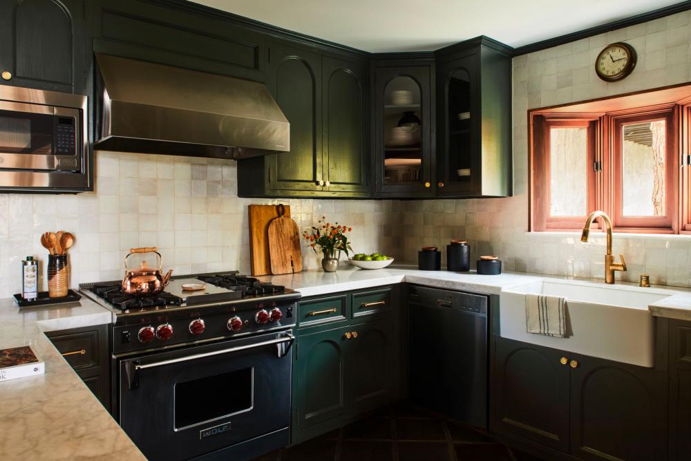 $!The dark green kitchen gives off a classy vibe