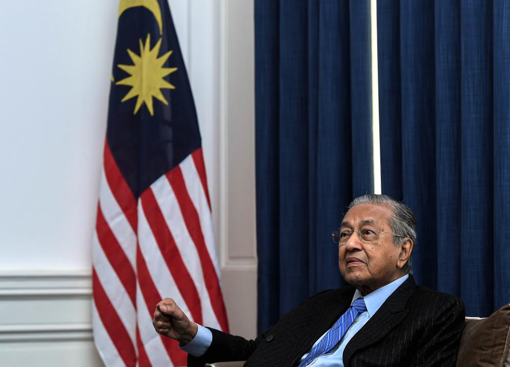Prime Minister Tun Dr Mahathir Mohamad speaks during a press conference in during his three-day visit to the United Kingdom, at the Malaysian High Commission in London on June 15, 2019. - Bernama