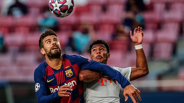 Barcelona’s Gerard Pique (left) in action against Bayern Munich’s Serge Gnabry during the Champions League quarterfinal in Lisbon. – EPAPIX
