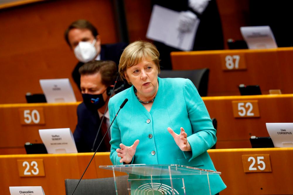 Merkel speaking during a plenary session at the European Parliament in Brussels, Belgium, today. – REUTERSPIX