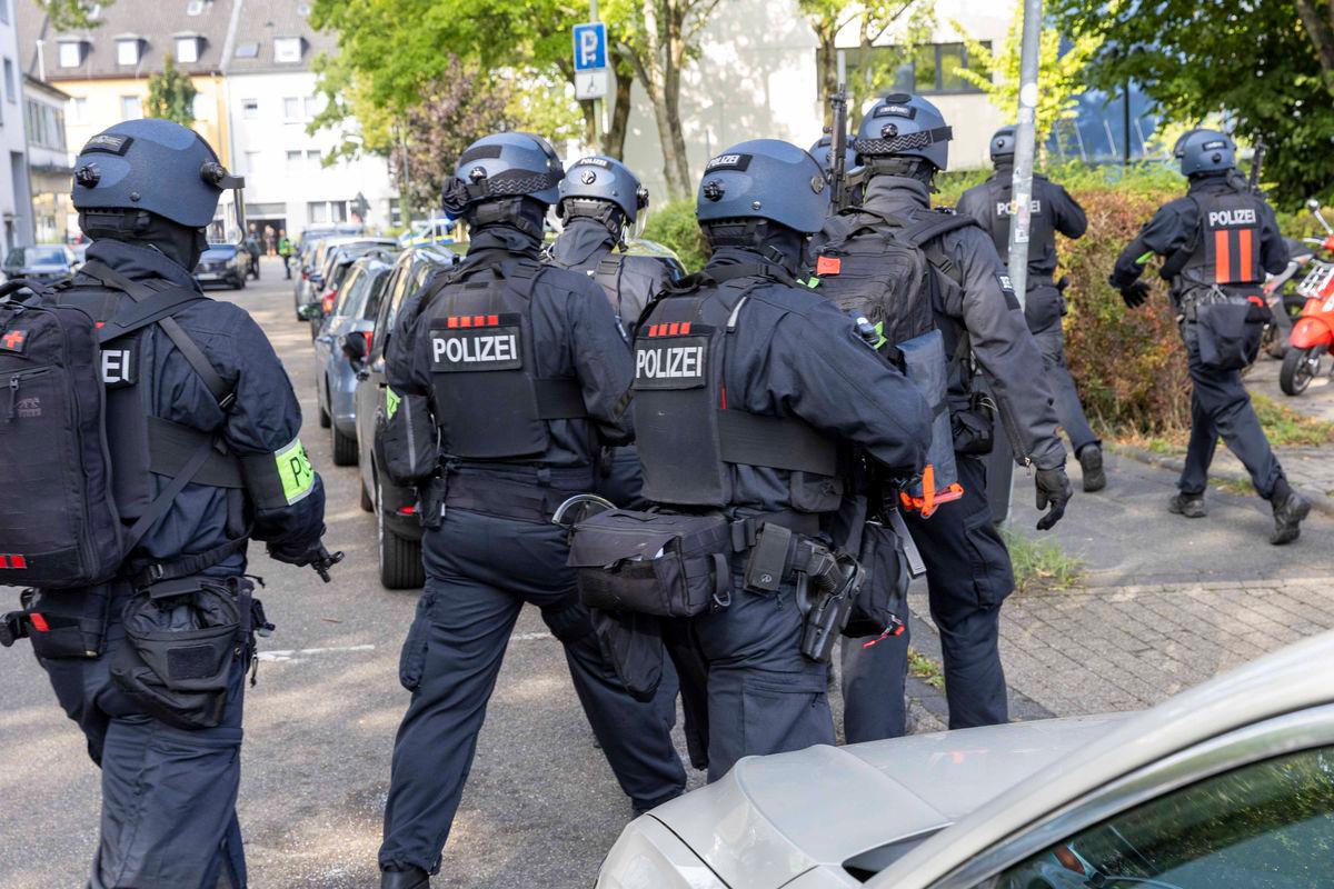 Policemen are seen on September 5, 2025 outside a vocational college in Essen, western Germany, where a teacher has been injured in a stabbing, according to police. Germany OUT
