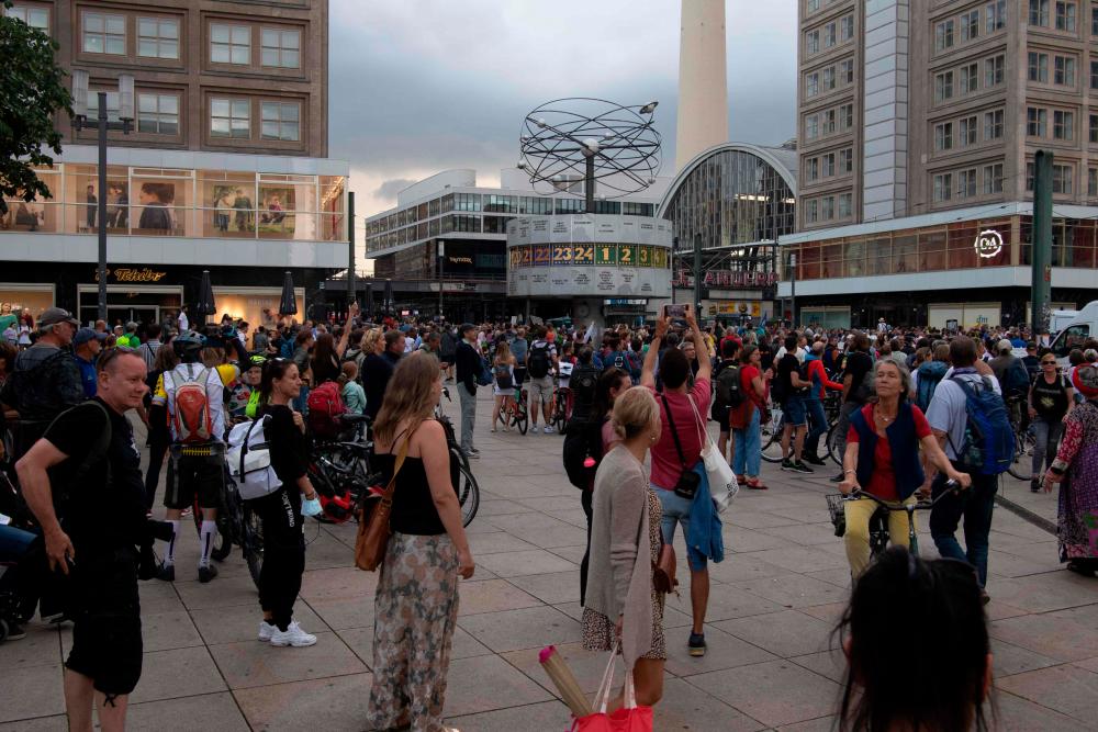 People demonstrate against Germany’s coronavirus restrictions to curb the spread of the COVID-19 virus at Alexanderplatz in Berlin, on August 01, 2021. -AFP
