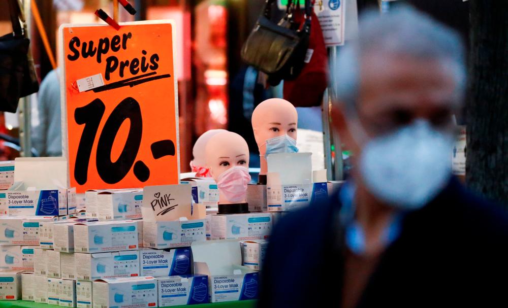 Face masks are on sale at Wilmersdorfer Strasse shopping street, as the coronavirus disease (Covid-19) outbreak continues, in Berlin, Germany, October 26, 2020. — Reuters