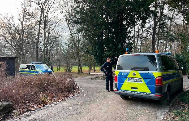 Police cars stand near the site of a stabbing in Aschaffenburg on January 22, 2025. A 41-year-old man and a two-year-old boy were killed and two other people severely injured in a knife attack in the German city of Aschaffenburg on Wednesday, police said. - Pascal HOEFIG / NEWS5 / AFP