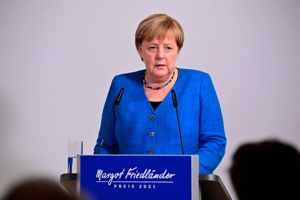 German Chancellor Angela Merkel delivers the laudatio during the Margot Friedlaender Prize 2021 award ceremony to honor young commitment against anti-Semitism, in Berlin on September 20, 2021. AFPpix
