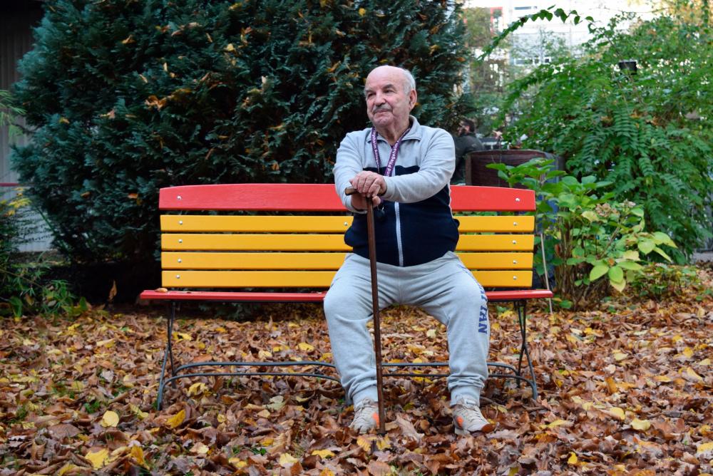 Ukrainian Holocaust survivor Borys Shyfrin sits on a bench in the garden of his care home in Frankfurt am Main, western Germany, on November 2, 2022. AFPPIX