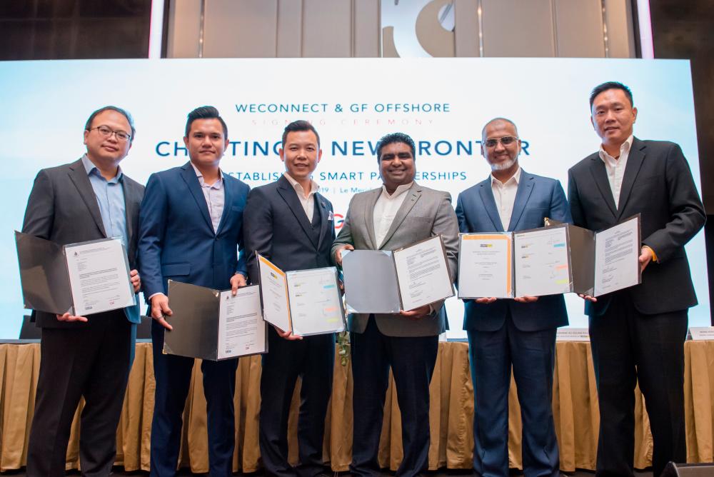 From left: WeConnect Tech International Inc director Datuk Stanley Wong, KL Bunkering (M) Sdn Bhd COO Mohamed Reza Arif, GF Offshore chairman and eConnect Tech International Inc CEO Datuk Brian Wee, Mahendran, Lumut Maritime Terminal Sdn Bhd CEO Mubarak Ali Gulam Rasul and PM Access World (Malaysia) Sdn Bhd general manager Wong Keng Meng at the signing ceremony.
