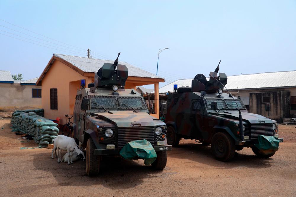 Armoured vehickles are positioned at a Military checkpoint at the Zug-raan palace in Bawku, northern Ghana, on December 7, 2022. AFPPIX