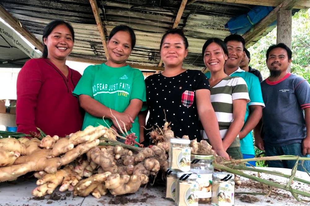Some of the programme’s participants with their harvest of ginger which they plan to pulverise and sell as ginger powder.