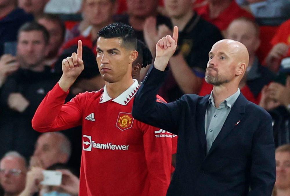 Football - Premier League - Manchester United v Liverpool - Old Trafford, Manchester, Britain - August 22, 2022 Manchester United’s Cristiano Ronaldo with manager Erik ten Hag before coming on as a substitute. REUTERSPIX