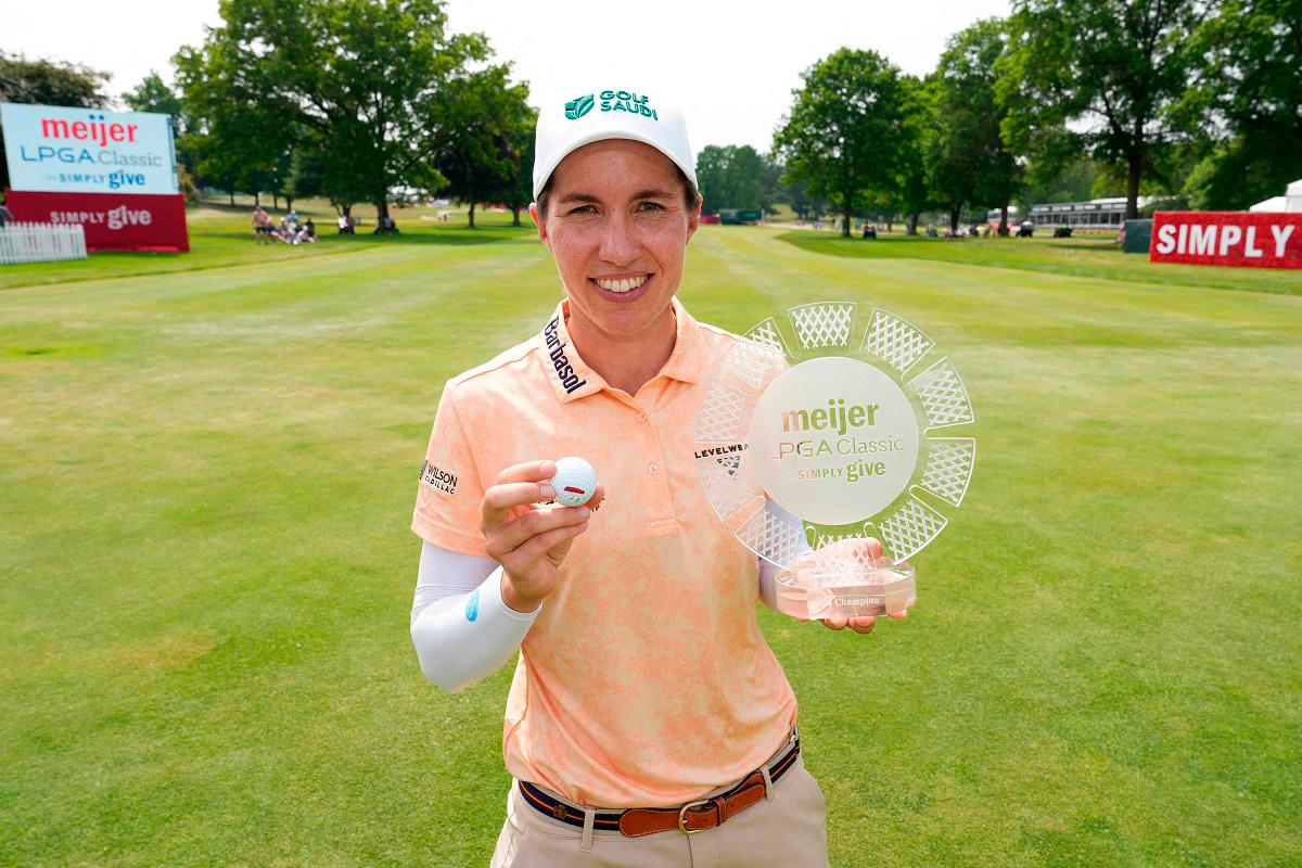 Carlota Ciganda of Spain poses for a photo with the trophy after winning the Meijer LPGA Classic for Simply Give 2025 at Blythefield Country Club on June 15, 2025 in Grand Rapids, Michigan. - Raj Mehta/Getty Images/AFP