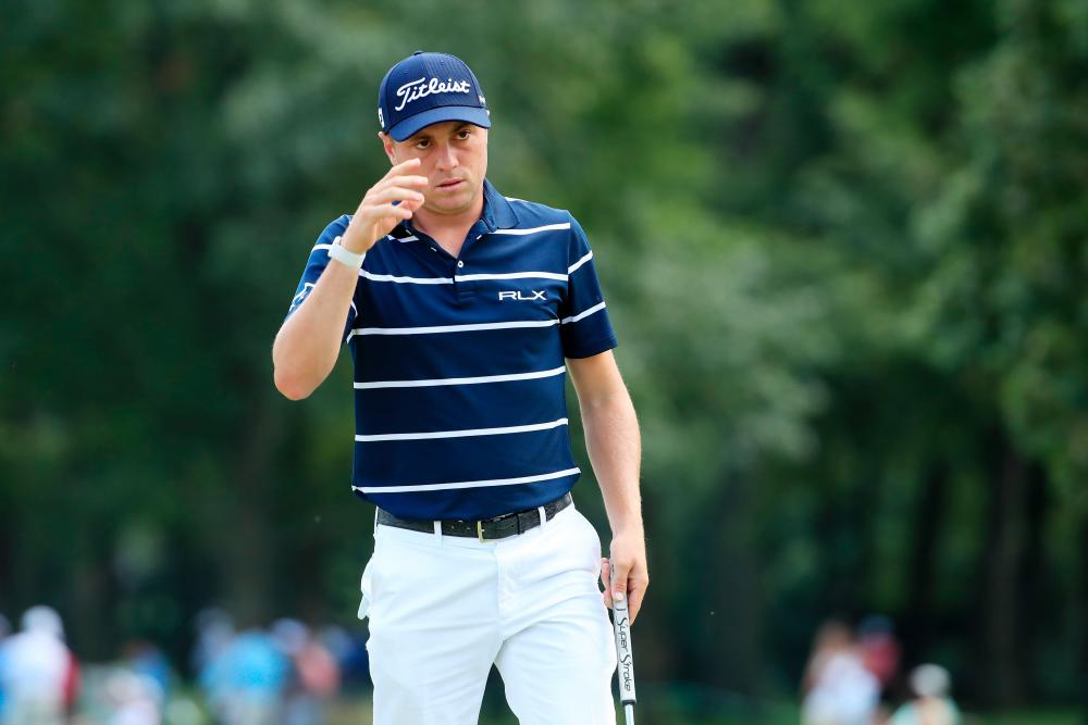 Justin Thomas of the United States reacts on the 18th hole during the first round of the BMW Championship at Medinah Country Club No. 3 on August 15, 2019 in Medinah, Illinois. — AFP