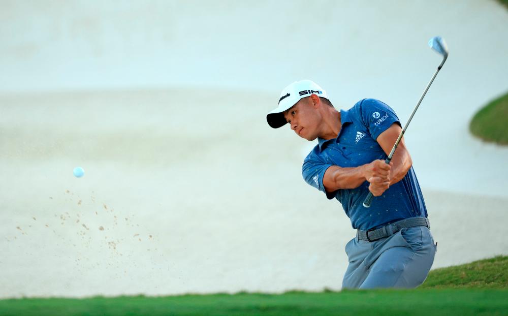 NASSAU, BAHAMAS - DECEMBER 04: Collin Morikawa of the United States hits his bunker shot on the 18th hole during the third round of the Hero World Challenge at Albany Golf Course on December 04, 2021 in Nassau. AFPpix