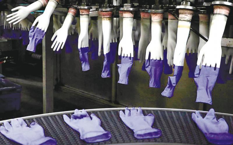 Gloves manufacturers made a fortune following the spike in demand for medical gloves during the pandemic. REUTERSpix