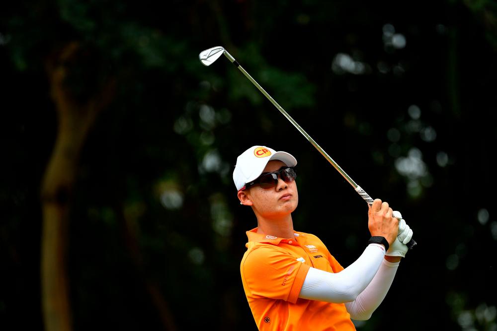 This handout photo from the Asian Tour taken and released on December 22, 2019 shows Jazz Janewattananond of Thailand hitting a shot during the final round of the Thailand Masters golf tournament in Pattaya. - AFP