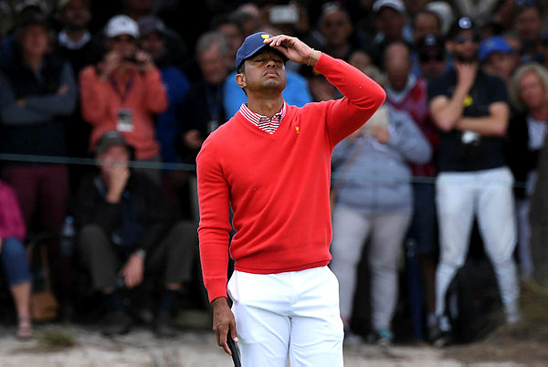 US team captain Tiger Woods reacts during day one of the Presidents Cup golf tournament in Melbourne on Dec 12, 2019 — AFP