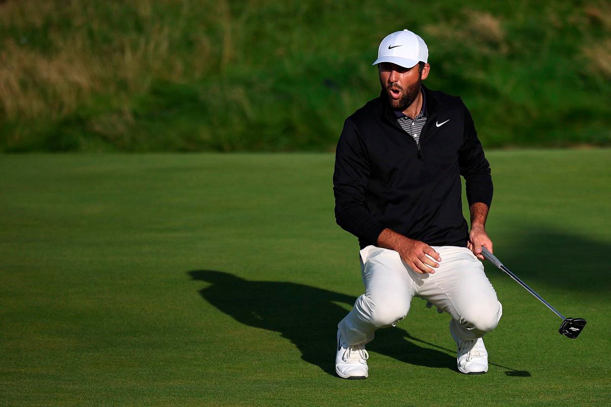 US golfer Scottie Scheffler reacts to a missed putt on the 17th green on day three of the 153rd Open Championship at Royal Portrush golf club in Northern Ireland on July 19, 2025. - HENRY NICHOLLS / AFP