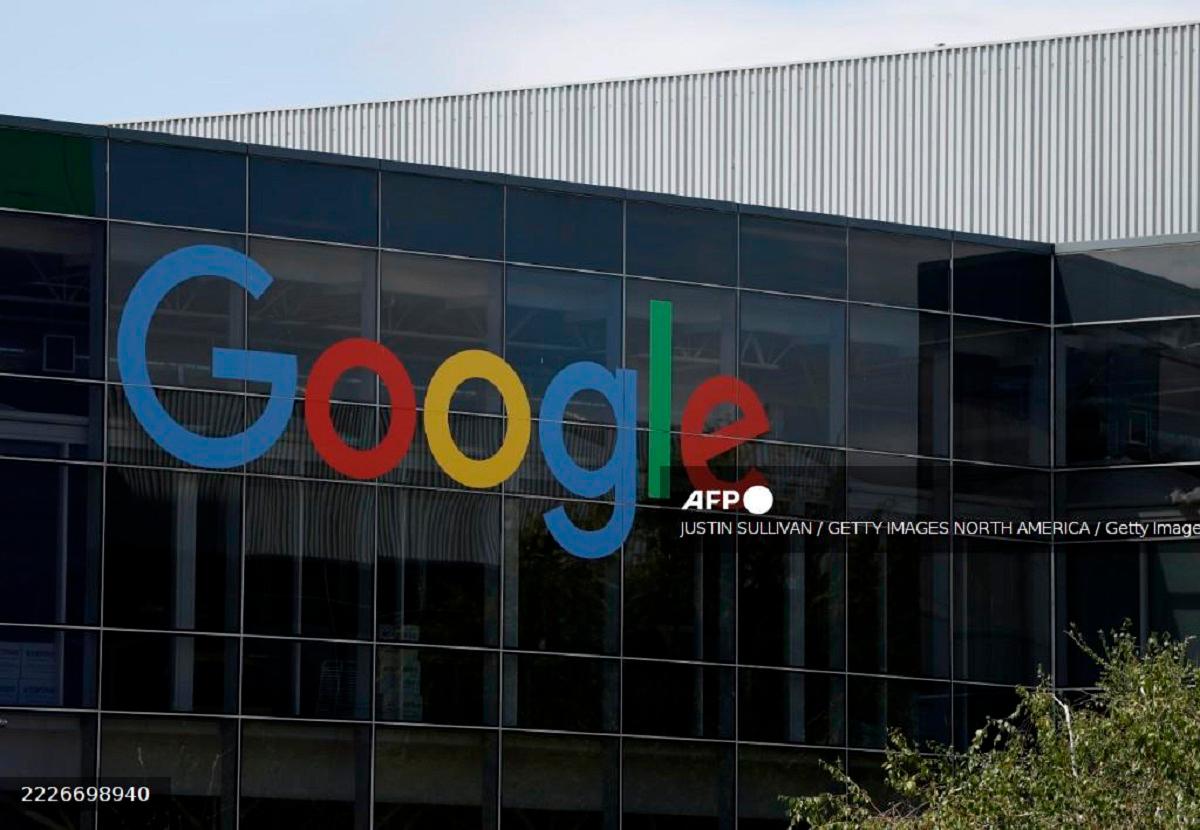 A sign is posted on the exterior of a building on the Google headquarters campus on July 23, 2025 in Mountain View, California. - Justin Sullivan/Getty Images/AFP